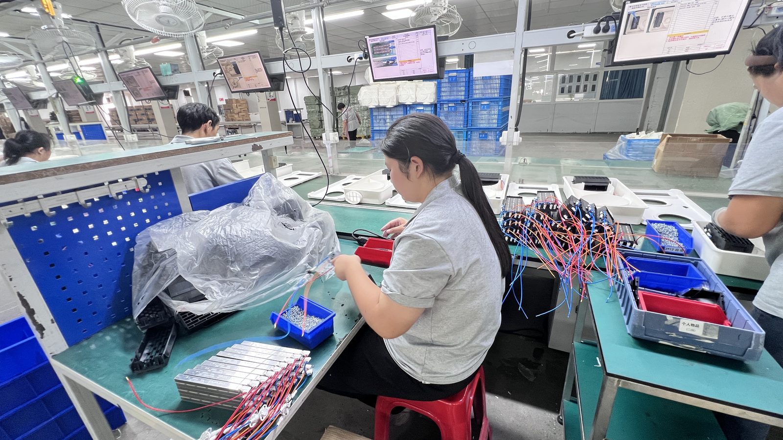 Operator inspecting components at the workstation