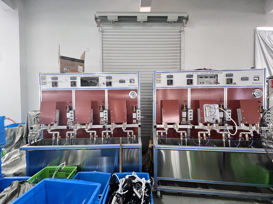 Quality control station testing instant water taps on the bench